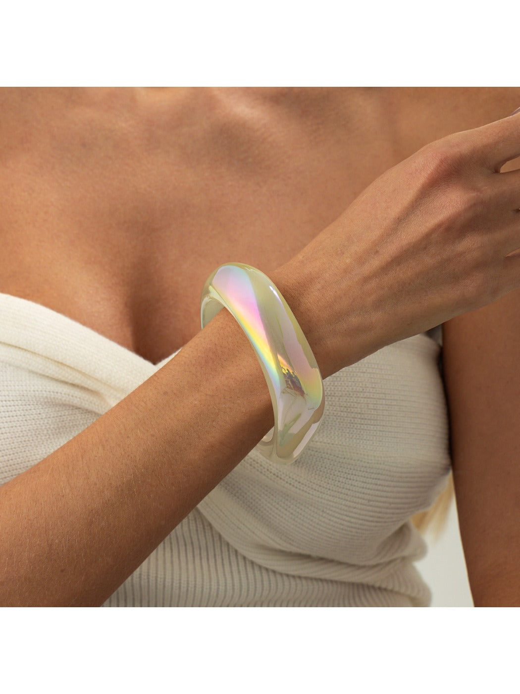 Lovra bangle bracelet displayed on a stand highlighting vibrant colors