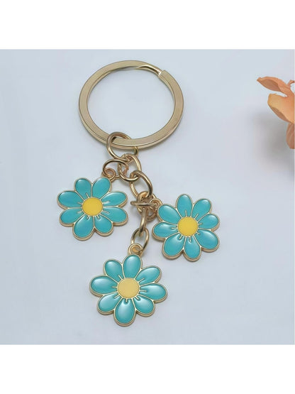 Peach blossom keychain displayed on a white background with soft shadows