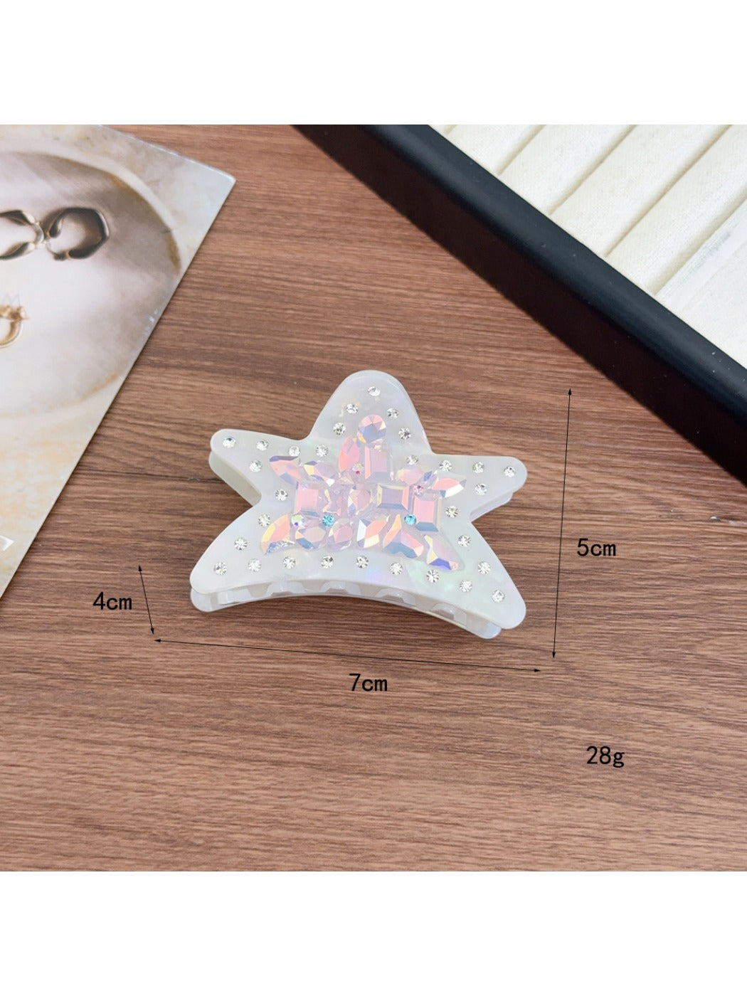 Beau shark claw clip placed on wooden surface with natural lighting