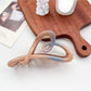 Beau ombre heart shaped bow claw clip shown in natural light highlighting color transition