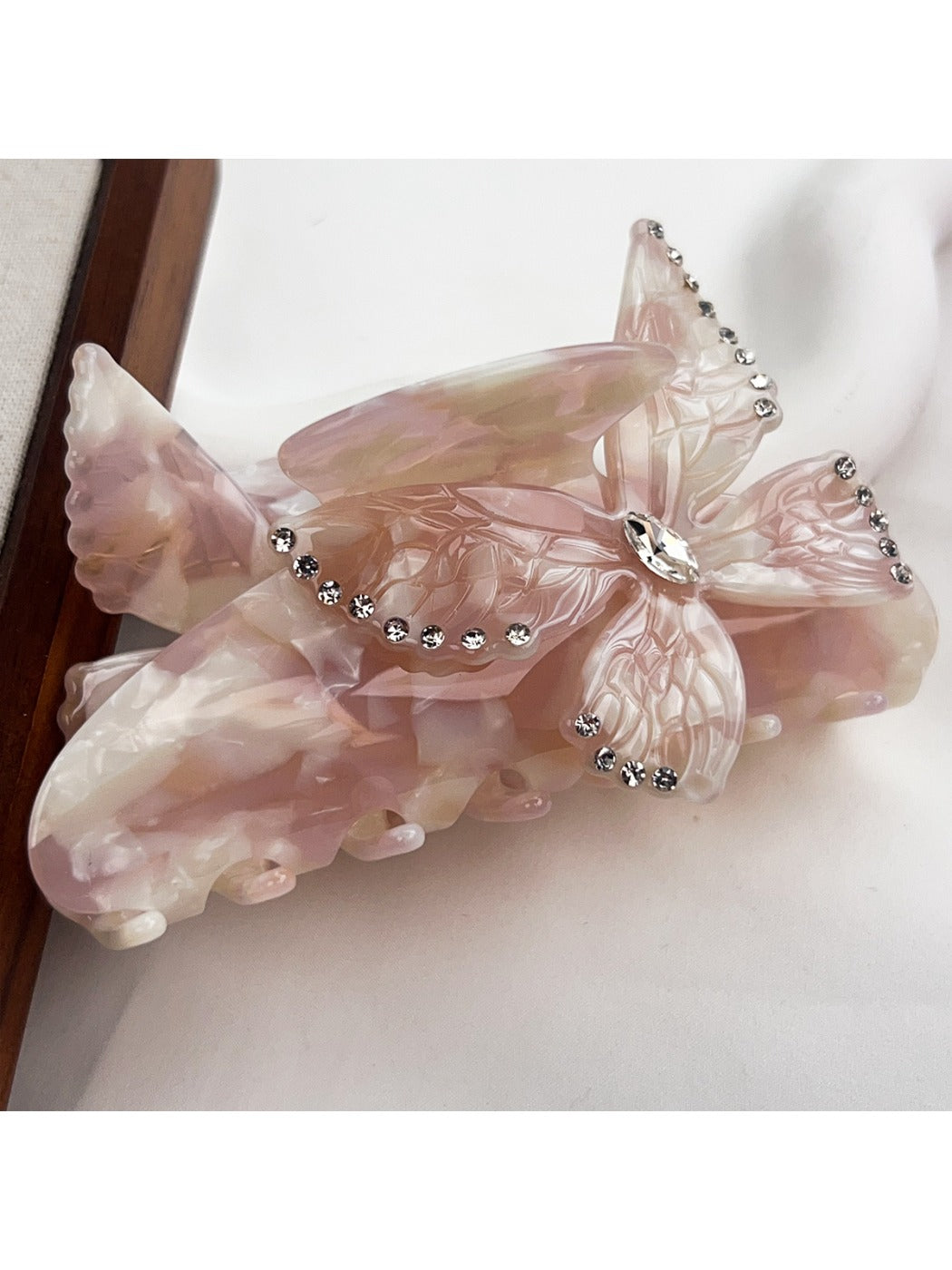 Top view of Beau colorful butterfly hair claw clip showing symmetrical design