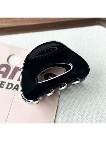 Beau minimalist claw clip angled to show smooth matte finish