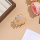 Beau vibrant acetate hair clip partially open to reveal inner clasp details
