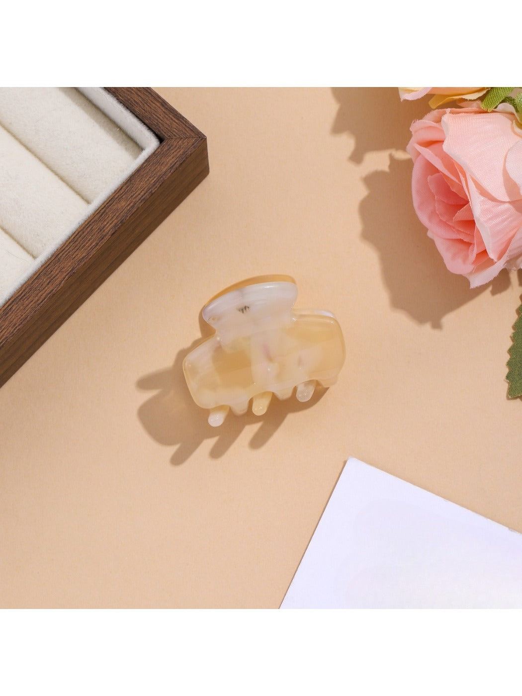 Beau vibrant acetate hair clip partially open to reveal inner clasp details