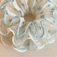 Gifty sweet floral ruffled scrunchie displayed flat highlighting ruffled edges and floral design