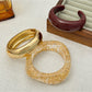 Lovra polished stackable bracelet with smooth metallic finish on wrist