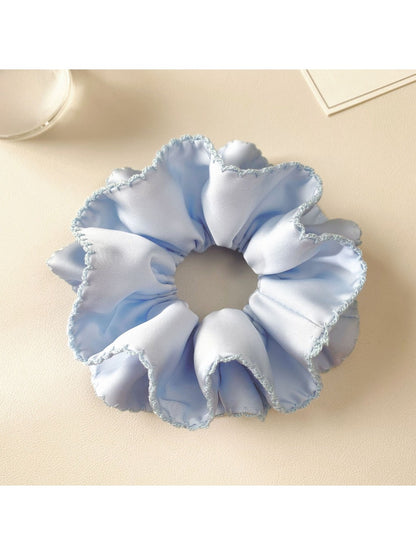 Blue satin double layer scrunchie with smooth and shiny fabric texture