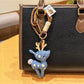 Keypus deer charm keychain held in hand to show size and detail
