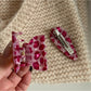 Beau pink leopard print hair clip styled in blonde hair