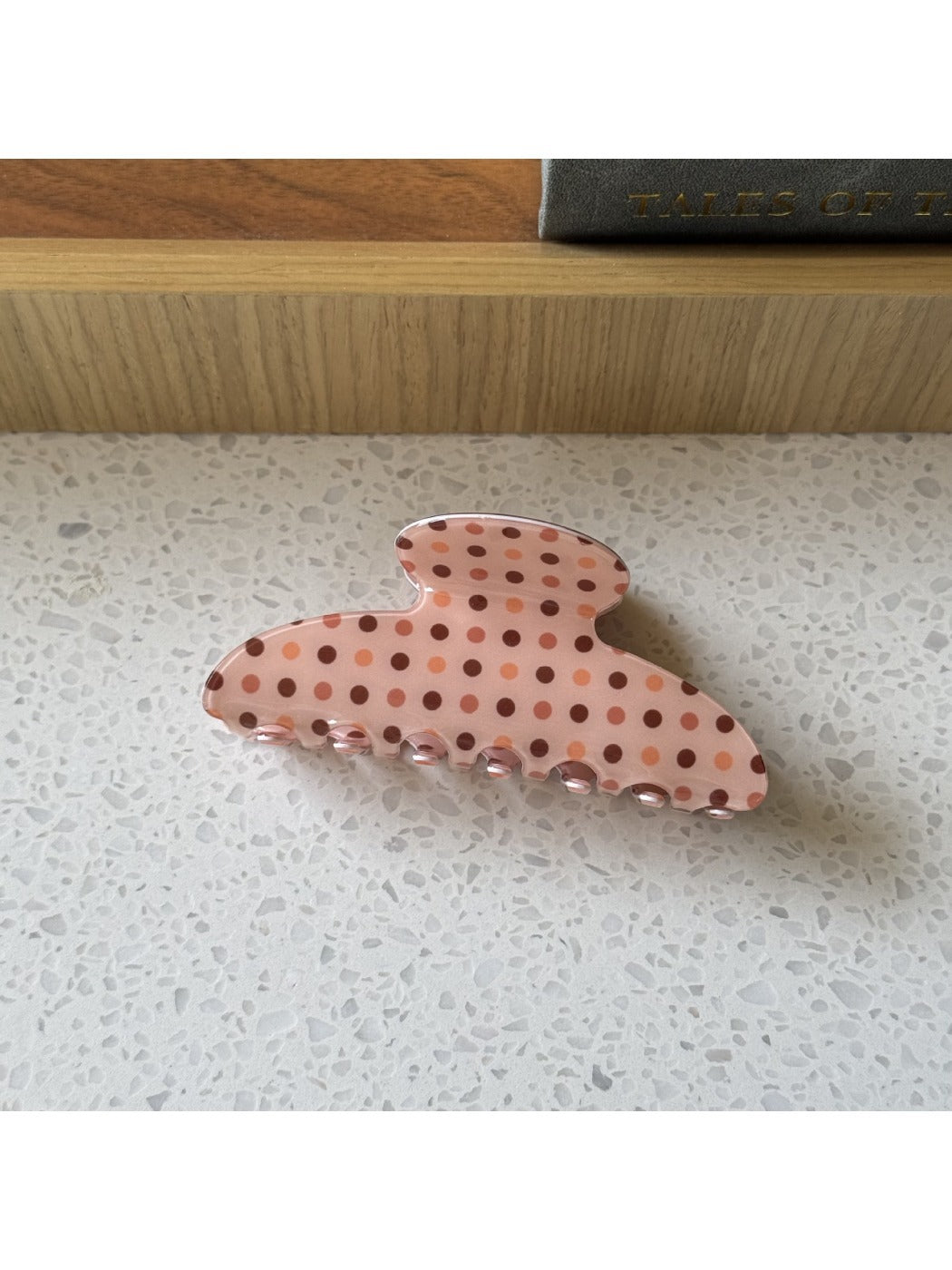 Beau polka dot claw clip displayed with matching hair accessories