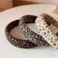 Gifty headband worn by a model with long hair styled back