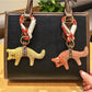 Close-up of adorable fox charm keychain with orange and white enamel details