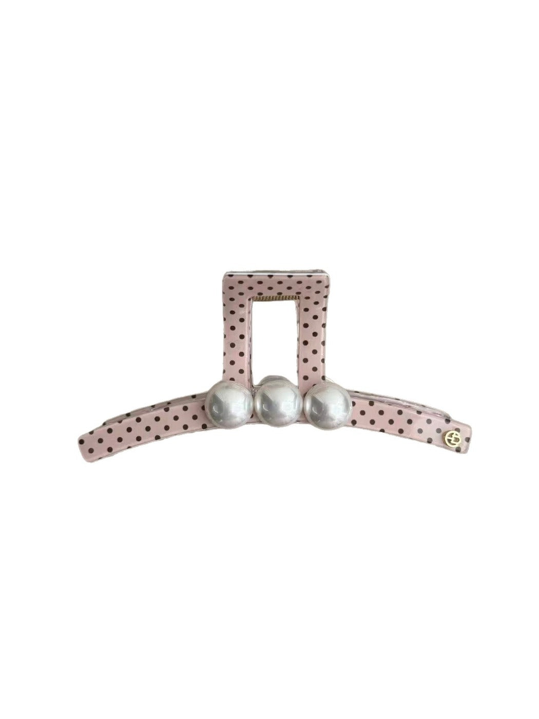 Close-up of Beau polka dot pink hair clip showing metal clasp and design details