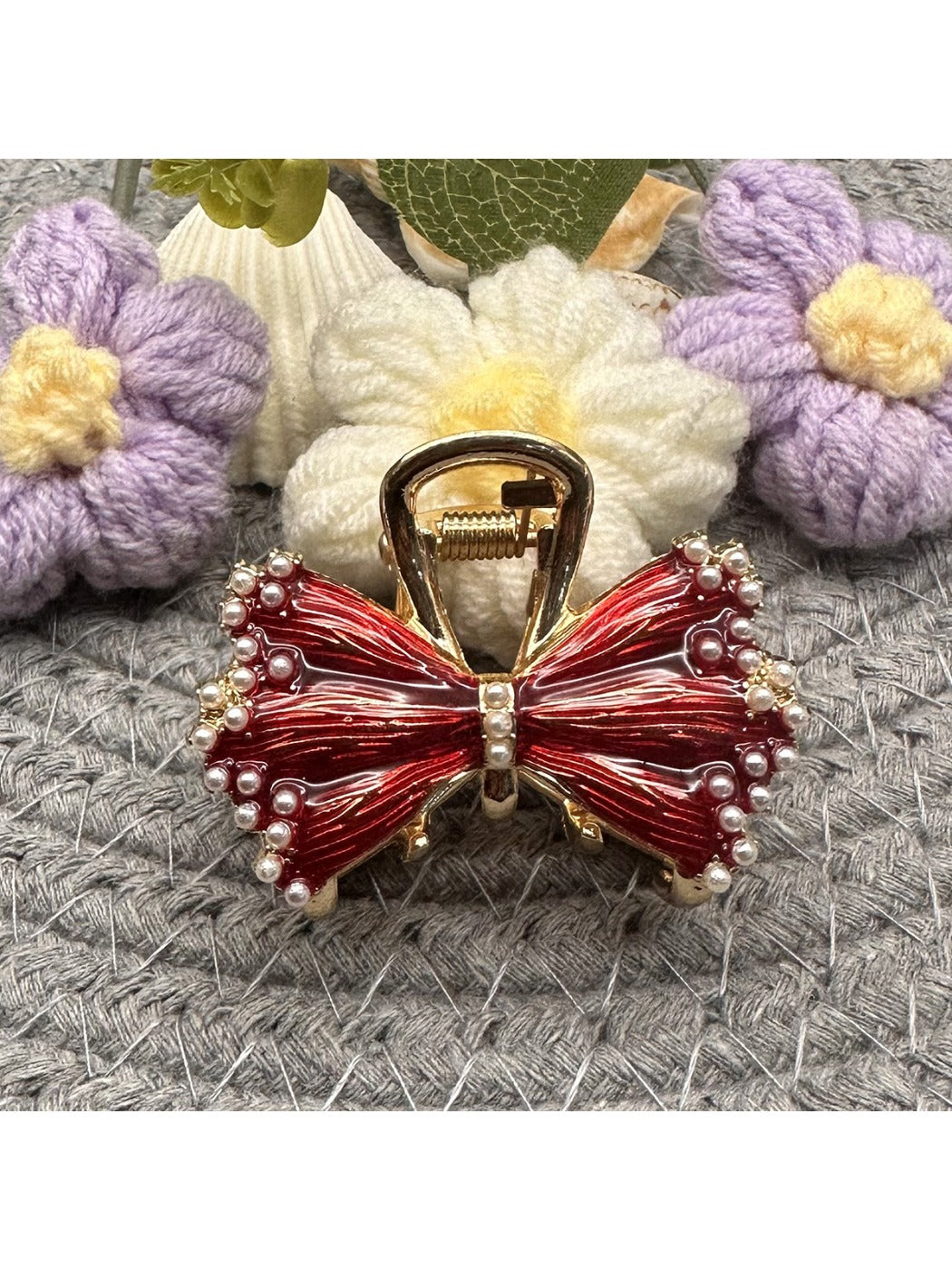 Close-up of Beau hair clip showing pleated bow detail and fabric texture