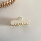Close-up of pastel green Beau rectangular hair clip highlighting smooth texture