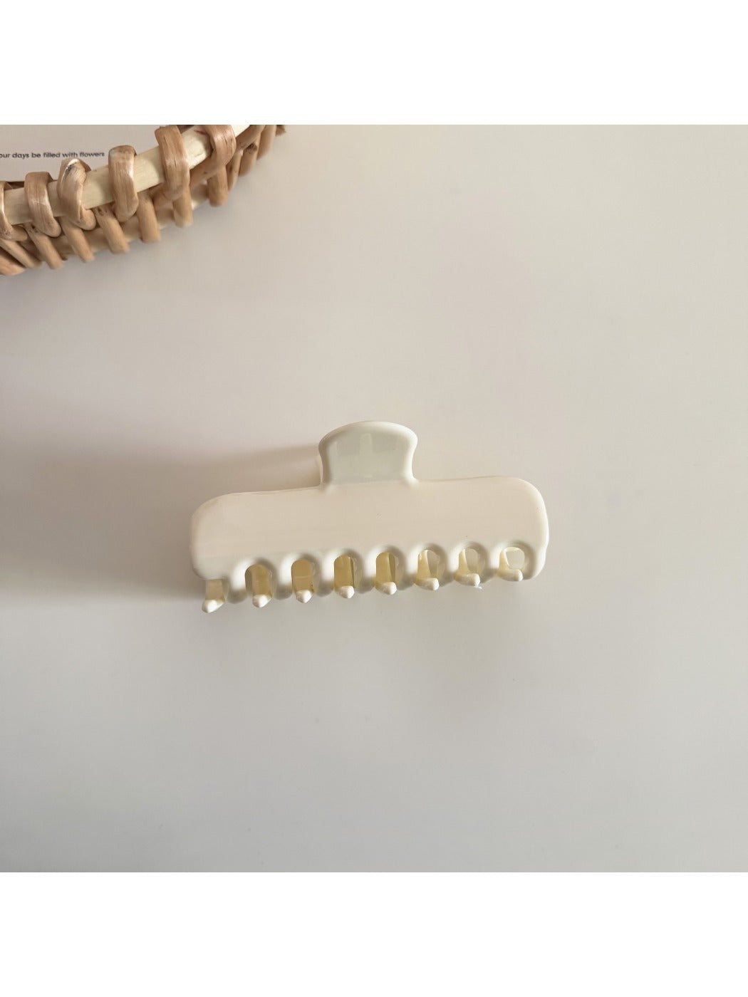 Close-up of pastel green Beau rectangular hair clip highlighting smooth texture