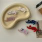 Beau cat shaped hair clip held in hand showing size and shape