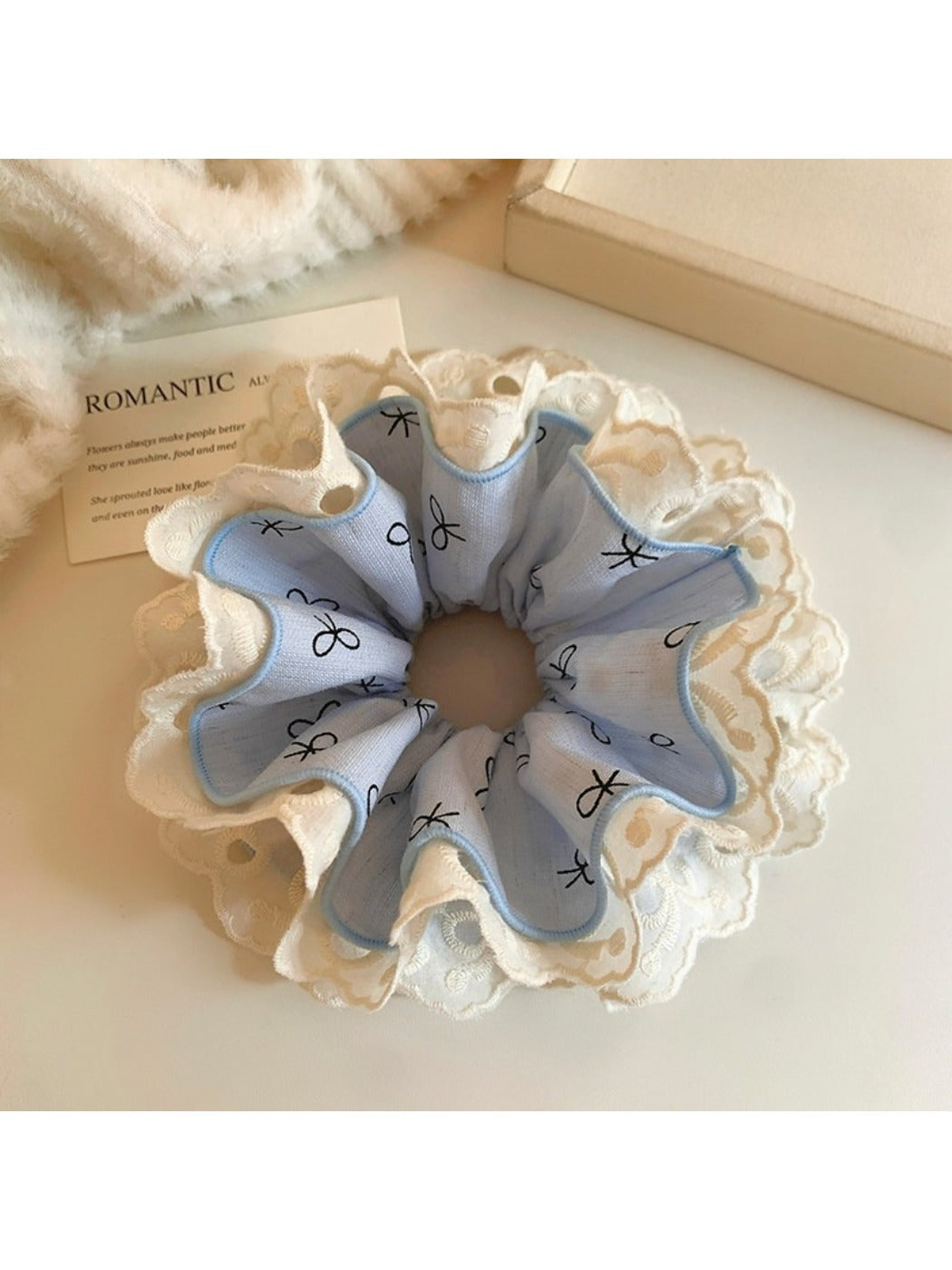 Flat lay of multiple Gifty bow print ruffled scrunchies in different pastel shades
