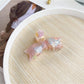 Model adjusting Beau sweet bow shaped hair claw clip in hair