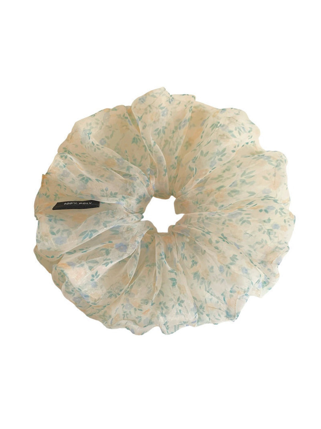Green tulle scrunchie with small white and pink flowers displayed on a white background