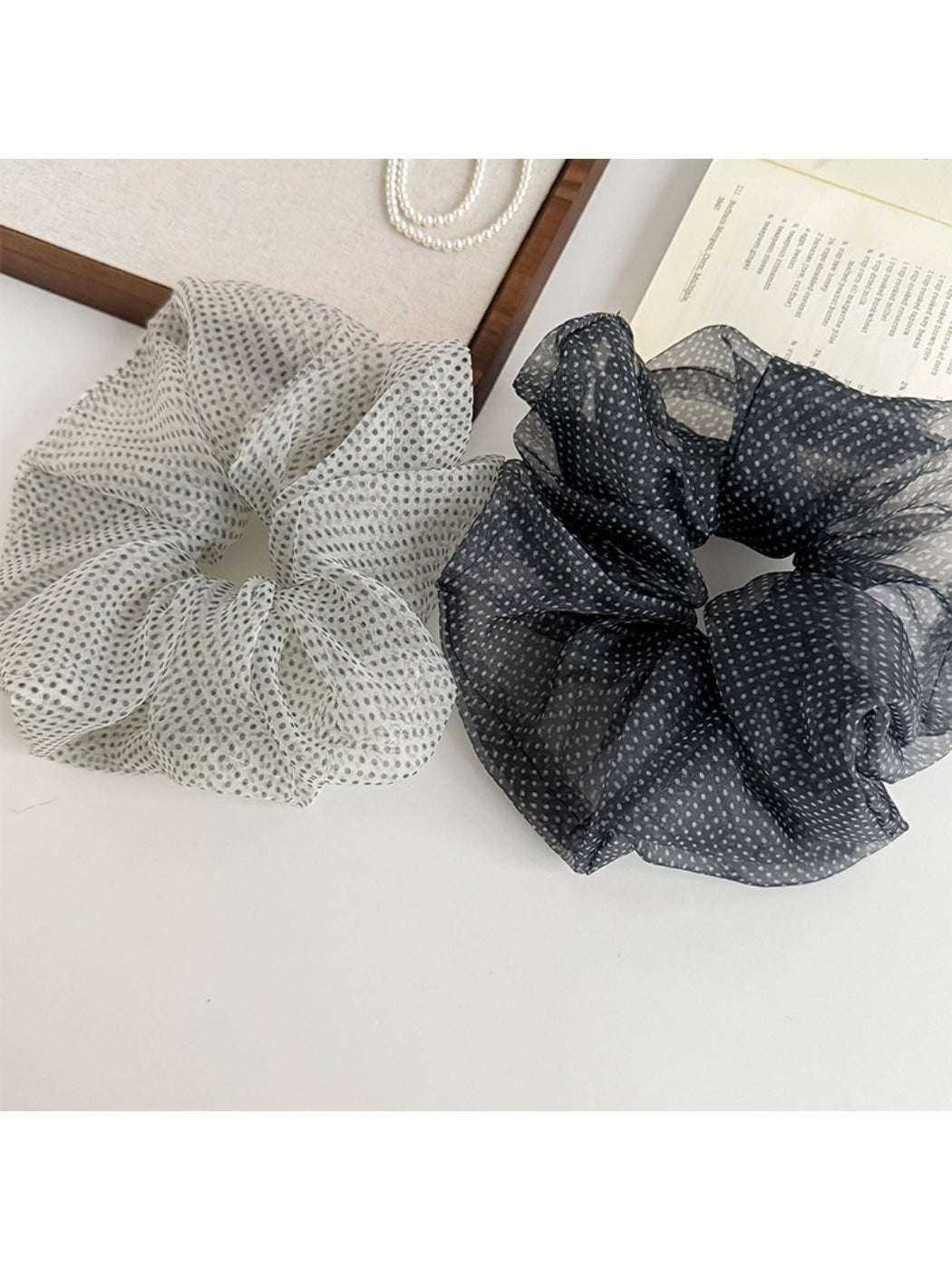 Soft breathable tulle scrunchie with white polka dots on light pink fabric