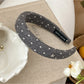 Solid color star hairband displayed on a flat surface with natural lighting