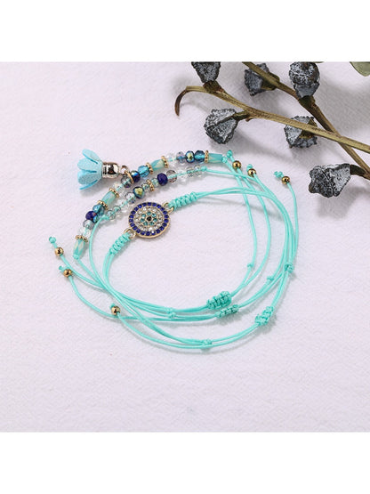 Lovra small bead tassel alloy bracelet shown with clasp and bead details