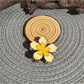 Beau lively sunny flower hair clip displayed on a white background