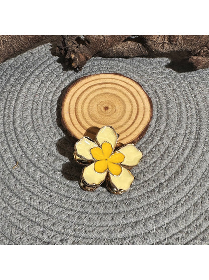 Beau lively sunny flower hair clip displayed on a white background