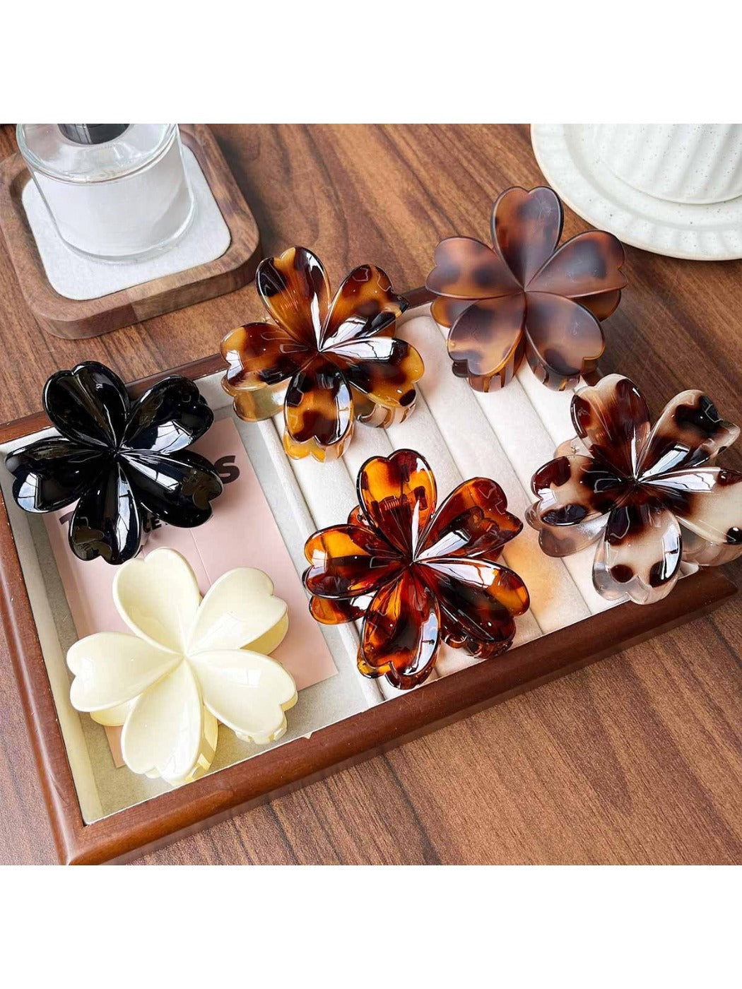 Side view of Beau flower shaped claw clip with leopard pattern