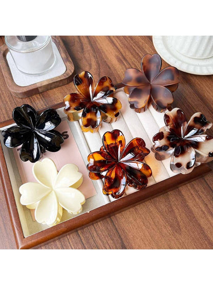 Side view of Beau flower shaped claw clip with leopard pattern