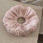 Satin scrunchie with ruched design placed flat to show full shape