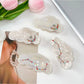 Close-up of Beau cloud shaped hair claw clip showing smooth edges and glossy finish