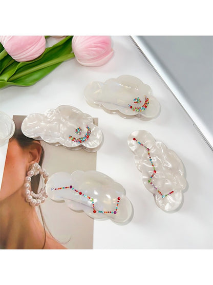 Close-up of Beau cloud shaped hair claw clip showing smooth edges and glossy finish