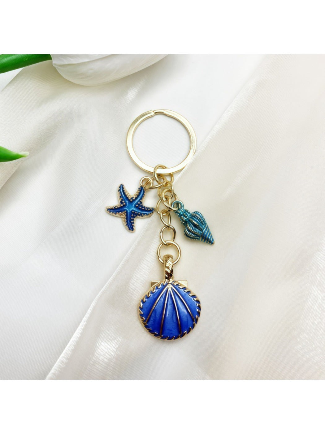 Overhead view of Keypus marine pendant keychain with visible metal ring
