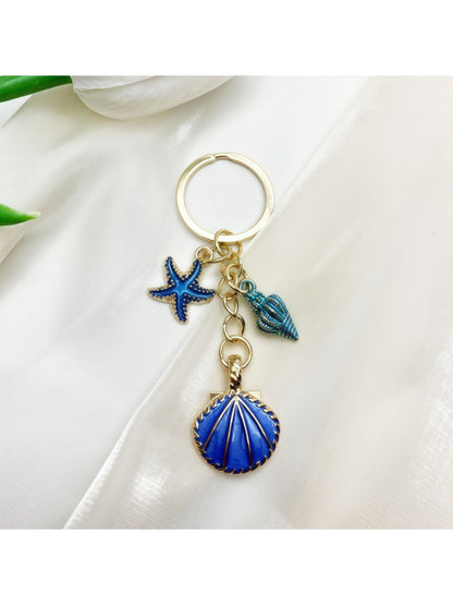 Overhead view of Keypus marine pendant keychain with visible metal ring