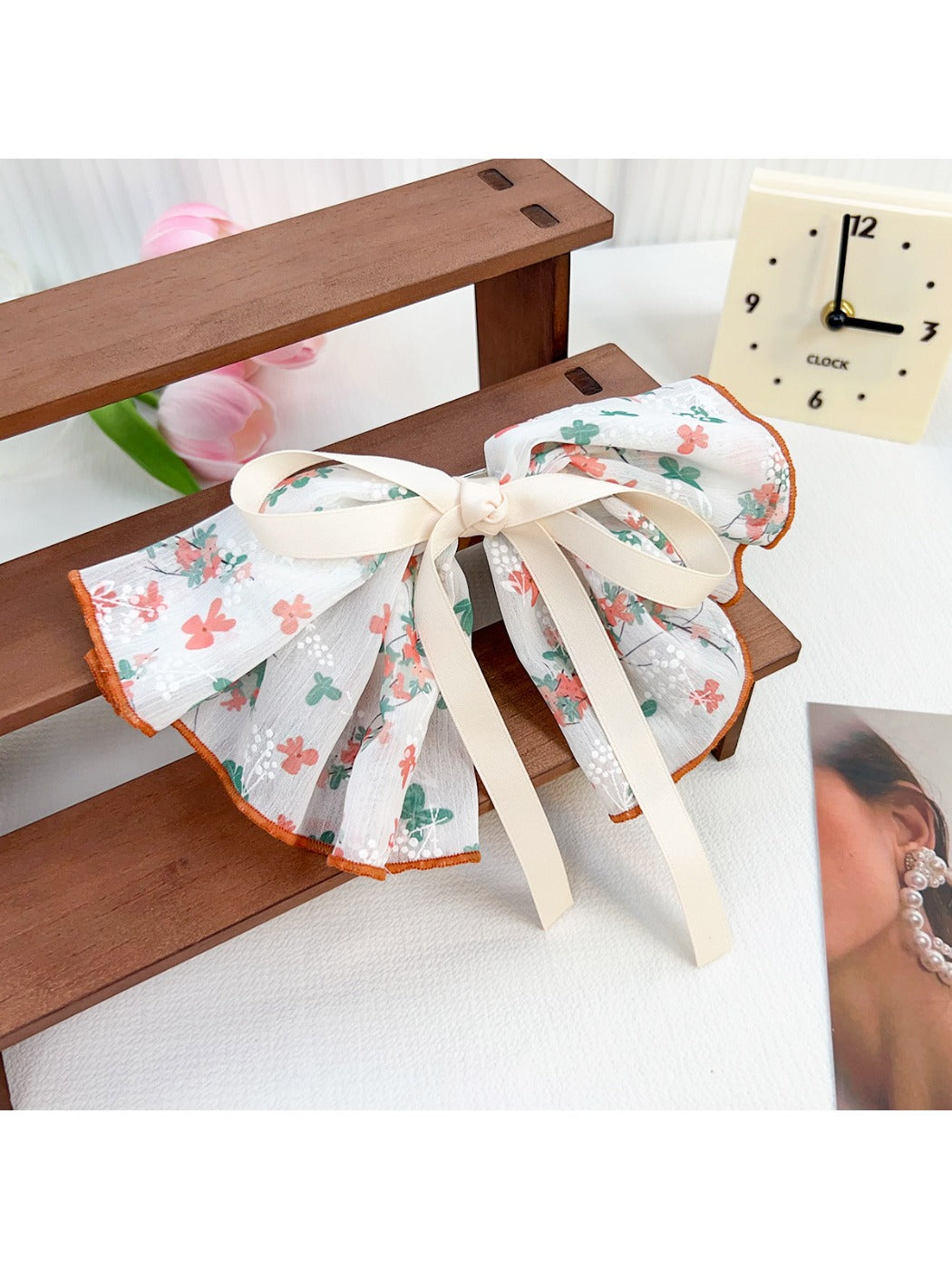 Beau Chic Sweet Bow Hair Clip packaged in branded box with clear window