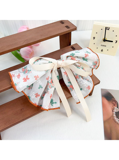 Beau Chic Sweet Bow Hair Clip packaged in branded box with clear window