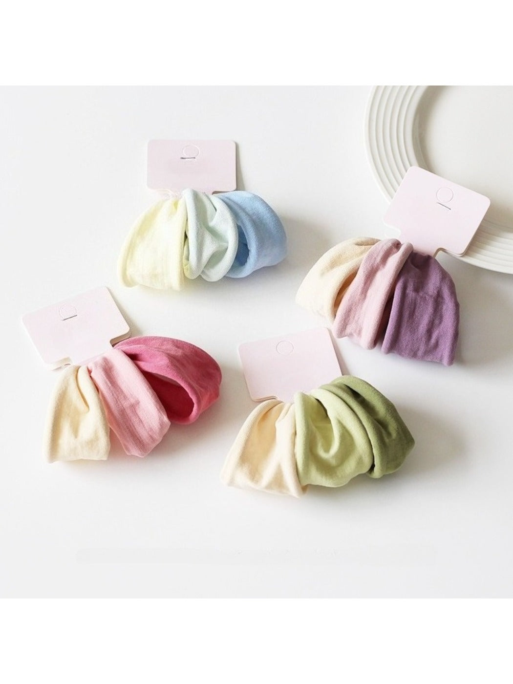 Close-up of a single solid color hair tie showing smooth fabric texture