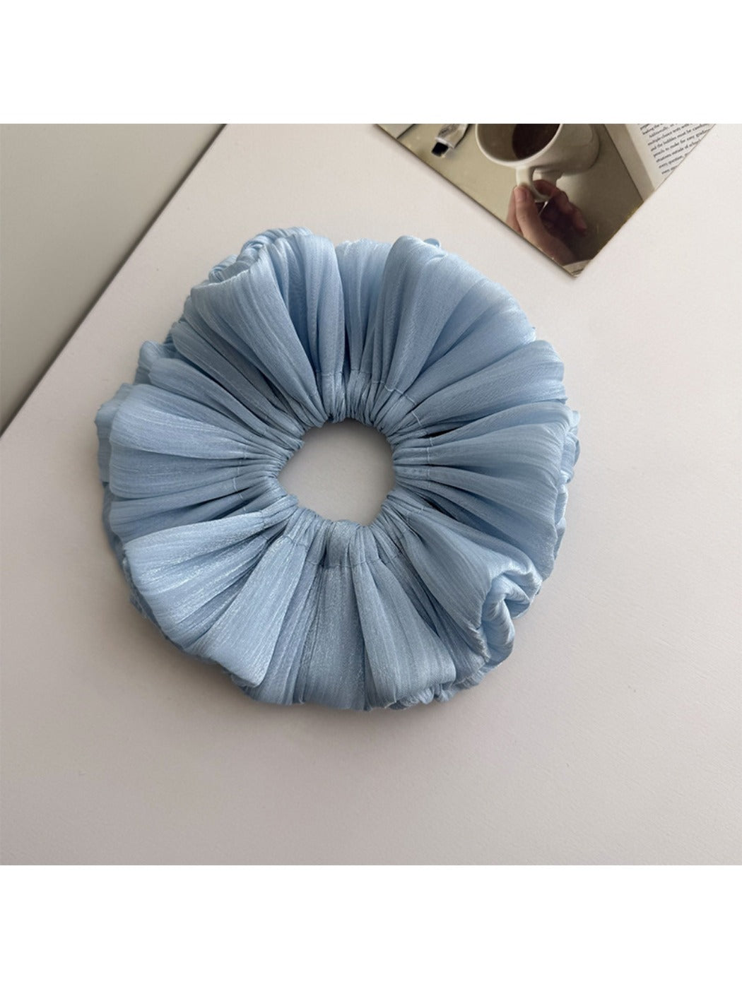 Top view of Gifty double layer shimmer scrunchie highlighting fabric layers