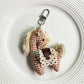 Fabric pony keychain showing detailed stitching and fabric texture