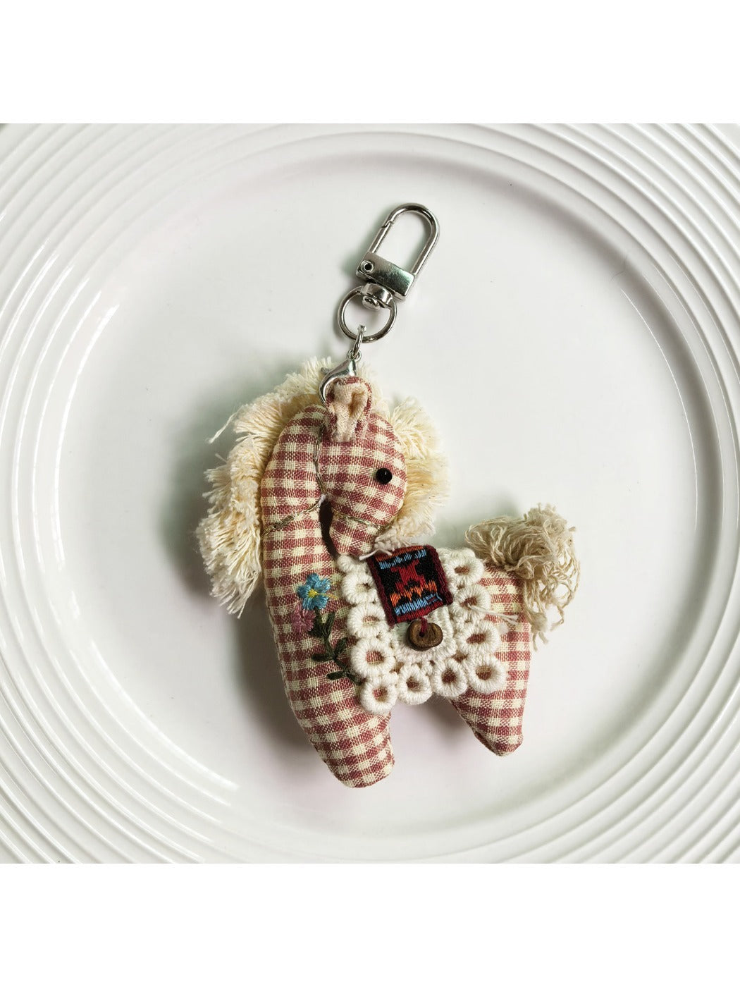 Fabric pony keychain showing detailed stitching and fabric texture