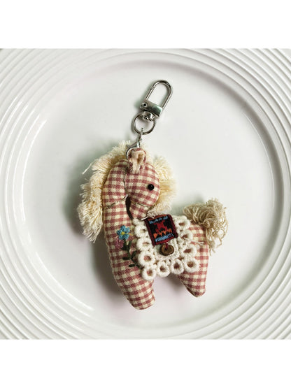 Fabric pony keychain showing detailed stitching and fabric texture