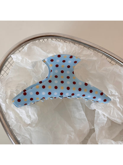 Beau blue hair clip styled in blonde hair