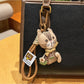 Detailed engraving on vintage cat charm keychain with floral patterns
