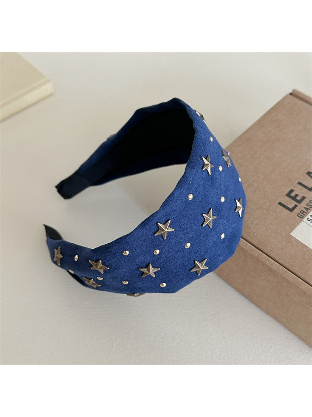 Close-up of gold star decorations on Gifty personalized headband