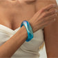 Lovra bangle bracelet with glossy finish and unique colorful pattern