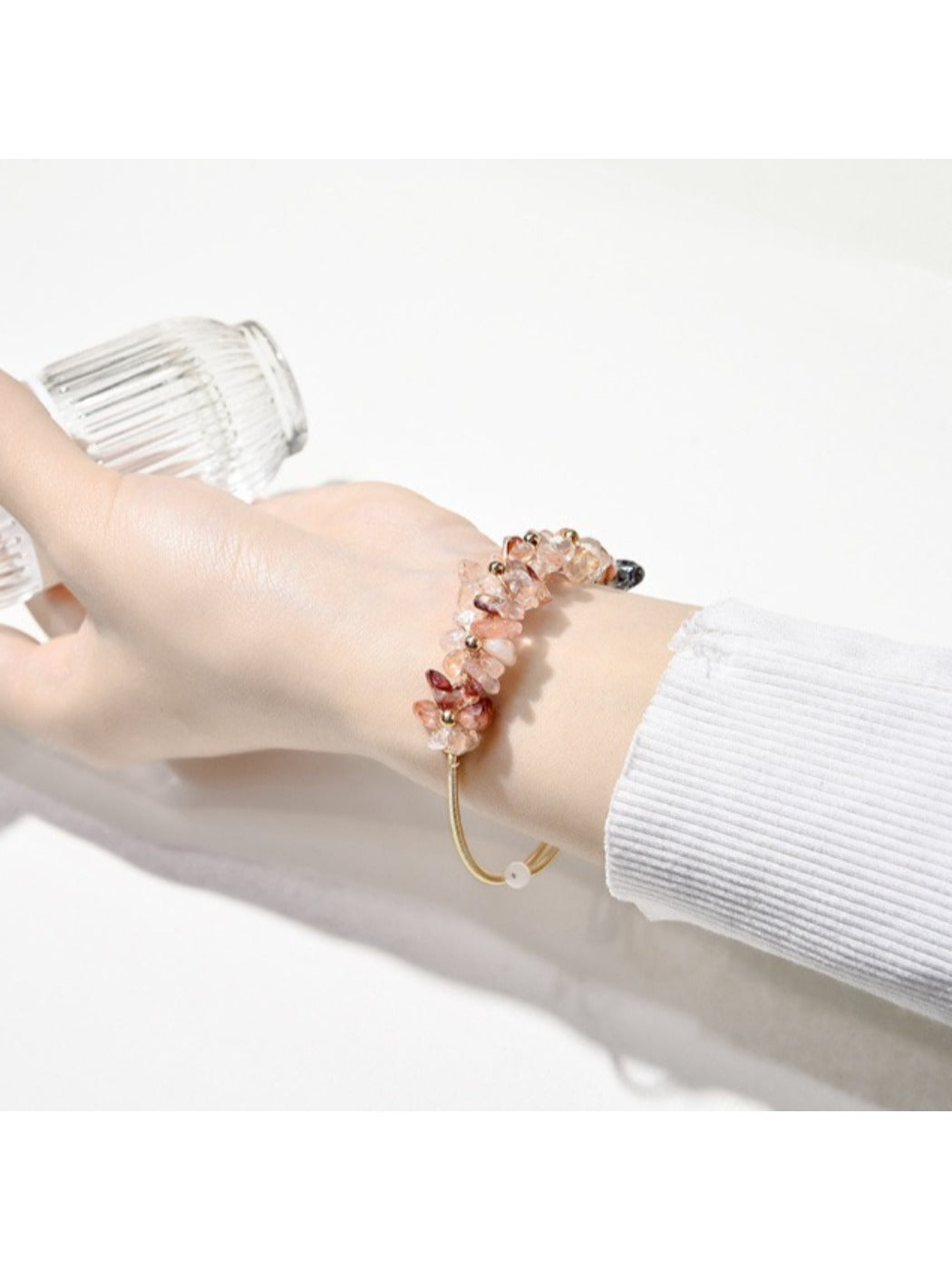 Side view of Lovra crystal charm bracelet with silver chain links