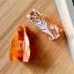 Beau tiger shape hair clip worn in long brown hair