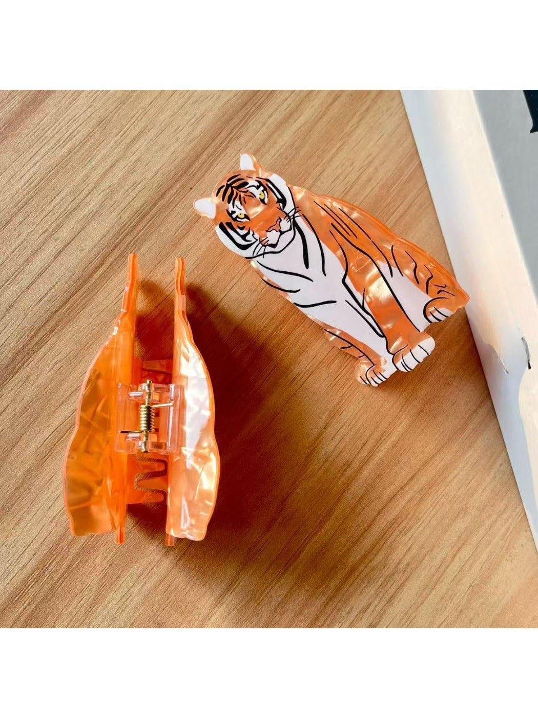 Beau tiger shape hair clip worn in long brown hair